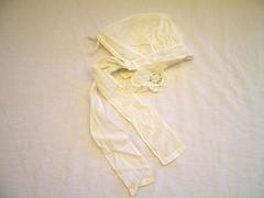 Child's Bonnet, White With Pink, Green, And Blue Embroidery