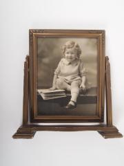 Photograph, Of a Seated Child with an Opened Book