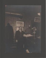 Photograph, Man Standing at Desk