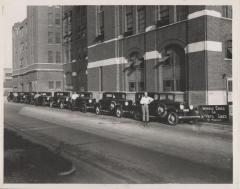 Photograph, Automobiles, Howard Sober Company, De Vaux Cars. Taken on 900 block of Broadway Avenue Northwest, Grand Rapids Michigan.