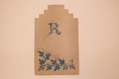 Needlepoint, 'r' And Blue Leaves On Cardboard