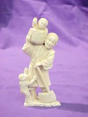 Figurine, Man With Ax Holding Child In Basket On Shoulder
