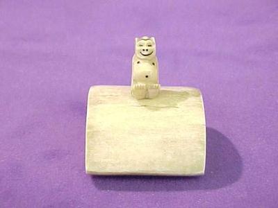Billiken Sitting On Platform